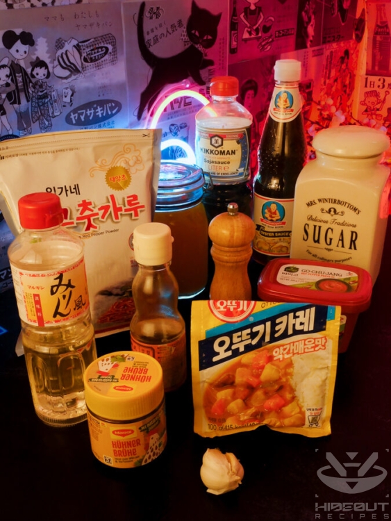 Ingredients for the sauce in Korean Dakgalbi are laid out on a table in their respective packaging.