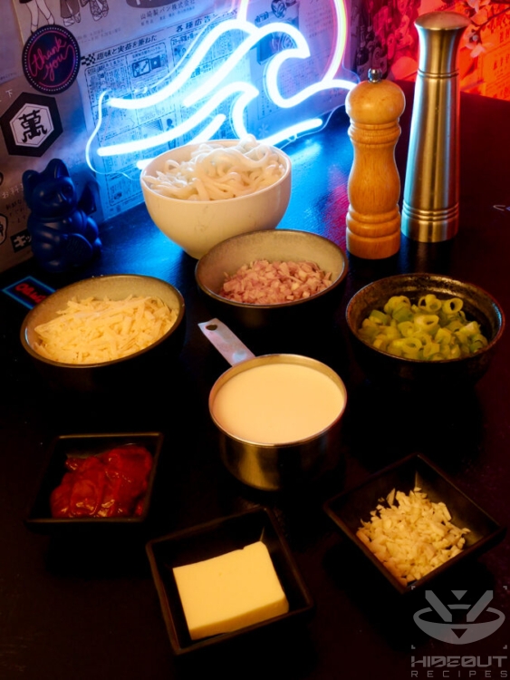 Pre-measured and processed raw ingredients for Gochujang Udon are distributed across a table.