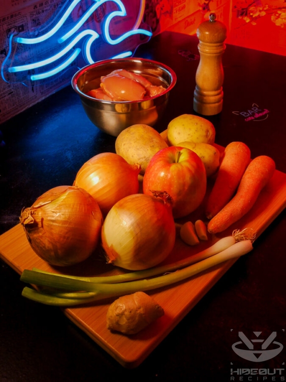 Unprocessed raw ingredients, mostly vegetables, for Japanese chicken curry lie on a table.