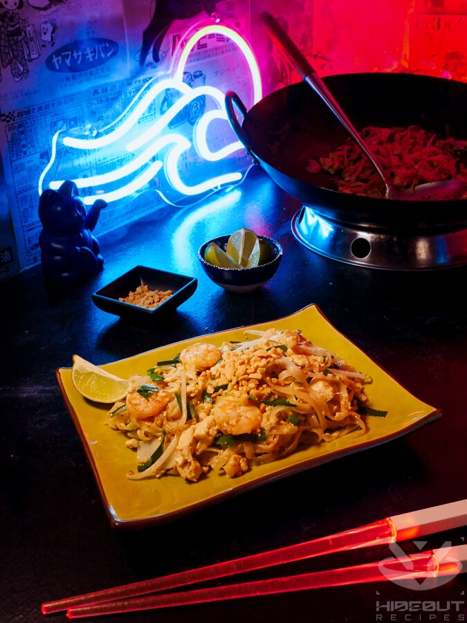 A futuristic Cyberpunk-style food photo showing a plate of Pad Thai in the foreground. Small bowls with toppings, glowing chopsticks, and a large wok surround it.