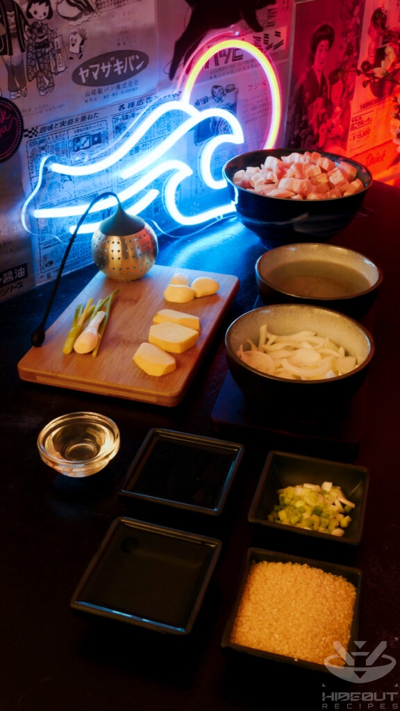 Pre-measured and prepared ingredients for Kakuni (Japanese pork belly) lie on a table, mostly distributed to small bowls.