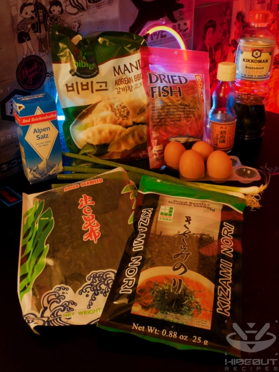 Ingredients for Manduguk (Korean dumpling soup) are laid out on a table in their packaging.
