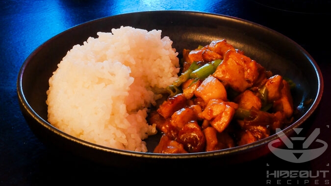 A futuristic Cyberpunk-style food photo showing a plate of Ginger Chicken and rice.