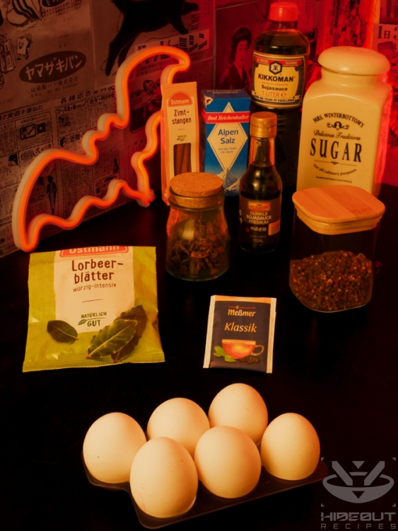 Ingredients for Chinese Tea Eggs are distributed on a table in their packaging.