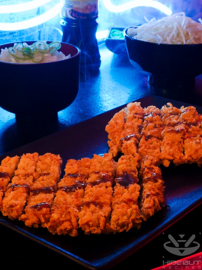 A futuristic Cyberpunk-style food photo showing a close-up of two crispy Japanese Tonkatsu pork cutlets on a plate, drizzled with Tonkatsu sauce. Bowls of rice and thinly sliced cabbage can be seen in the background.