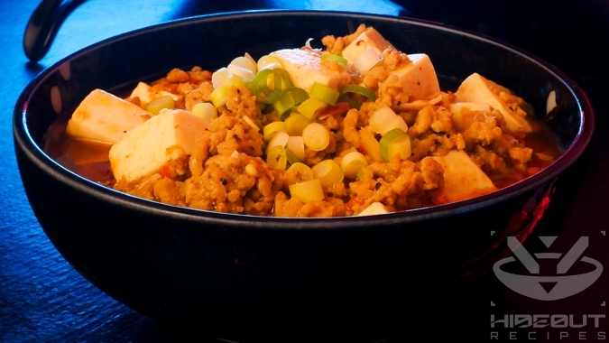 A futuristic Cyberpunk-style food photo showing a close-up of two bowls of Chinese (Sichuan) Mapo Tofu.
