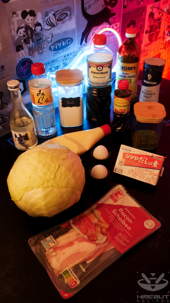 Ingredients for Japanese Tonpeiyaki (cabbage and pork omelet) are laid out on a table in their packaging.