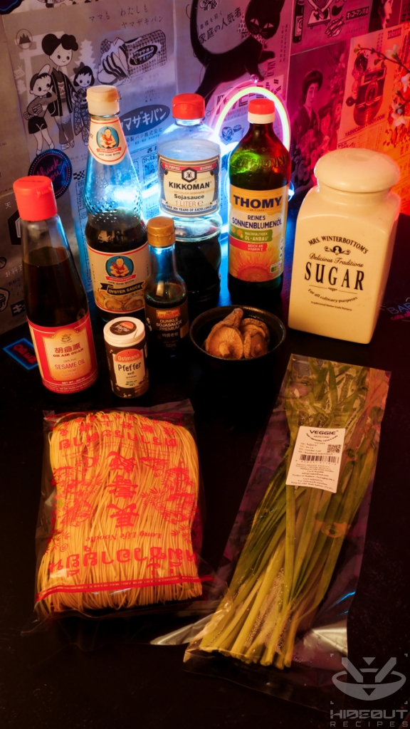 The ingredients for Yi Mein (Long Life Noodles) are laid out on a table in their respective packaging.