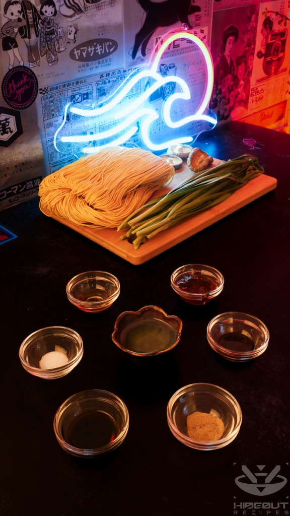 The ingredients for Yi Mein (Long Life Noodles) are laid out on a table. There are multiple small bowls of pre-measured condiments in the foreground.