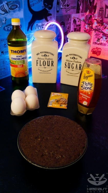 A bowl of sweet red bean paste, surrounded by ingredients for Dorayaki in their packaging.