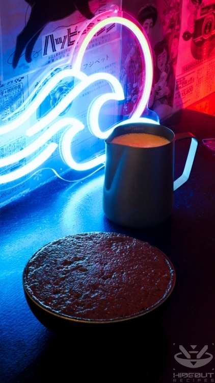 A bowl of sweet red bean paste and a jug with spout containing Dorayaki batter.